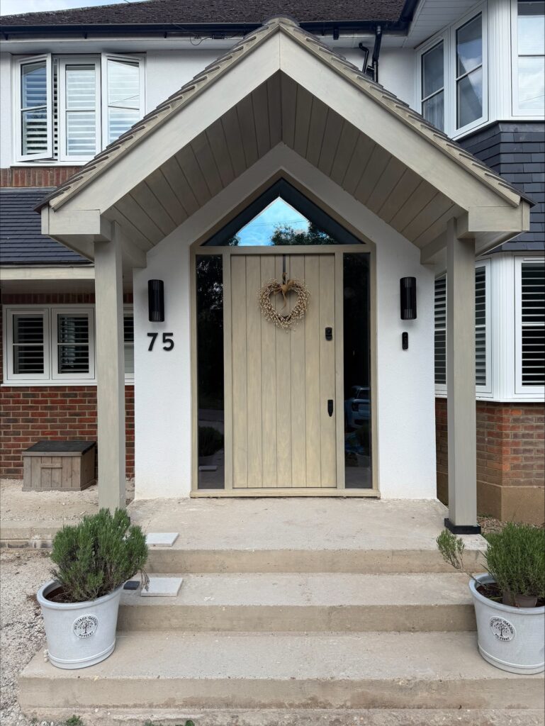 New timber-framed front porch with solid timber door